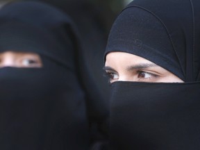 &ampgt;Many readers have concerns about women wearing veils. — Getty Images