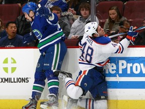 Dale Weise (left) gets a chance to hit it off with Cody Hodgson and Andrew Ebbett tonight.