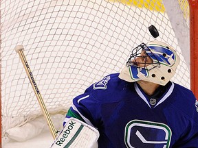 Vancouver Canucks goalie Roberto Luongo looks for the puck as the Canucks battle against the San Jose Sharks at Rogers Arena on Jan. 2. (Mark van Manen/PNG)