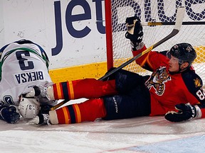 Tomas Kopecky of the Florida Panthers collides with Kevin Bieksa of the Vancouver Canucks at the BankAtlantic Center on Monday in Sunrise, Fla.
(Eliot J. Schechter/NHL Getty Images)