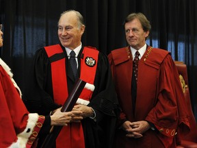 His Highness, The Aga Khan receives an honorary doctorate Jan. 13 from the University of Ottawa for his service to humanity as university Chancellor Huguette Labelle, left, and university president Allan Rock look on. (Postmedia News)