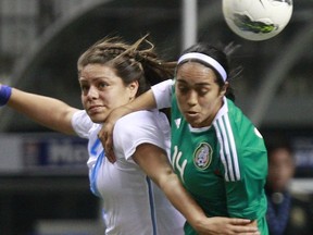 Renae Cuellar of Mexico battles Shannon Brooks of Guatemala during Olympic qualifying. (Jeff Vinnick/Getty Images)