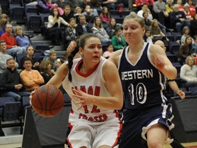 SFU's Carla Wyman (left) drives past Trishi Williams of Western Washington during GNAC women's basketball game Saturday at the West Gym. (Jenelle Schneider, PNG)