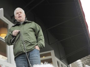 Dave Norris and Baxter walk along 4th Avenue in Vancouver. Norris admits he's tied up Baxter briefly while running into a store. (Wayne Leidenfrost/ PNG FILES)