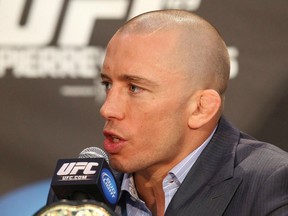 Injured UFC welterweight champion Georges St-Pierre hopes to return in the fall, and would prefer to see Nick Diaz standing across the cage from him next. (Photo from Tom Szczerbowski/Zuffa LLC/Zuffa LLC via Getty Images)