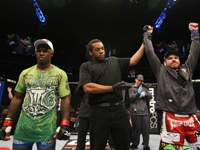 NASHVILLE, TN - JANUARY 20:  Jim Miller (R) celebrates after defeating Melvin Guillard (L) by submission during the UFC on FX event at Bridgestone Arena on January 20, 2012 in Nashville, Tennessee.  (Photo by Josh Hedges/Zuffa LLC/Zuffa LLC via Getty Images)