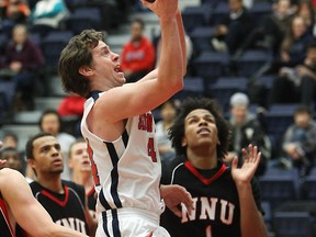 North Vancouver's Connor Lewis drives the net in SFU's GNAC basketball game against Northwest Nazarene University at Simon Fraser University. (Ron Hole, SFU athletics)