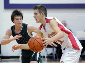 Luc Comeau (left), ace point guard for Double A No. 1 Mission, keeps close wraps of Alex Nesterenko of Triple A Terry Fox during Emerald Tournament semifinals Friday at Vancouver College. (PNG photo)