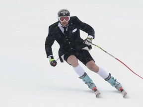Olympian Marco Buechel skiing the last run of his career in March 2010 wearing custom made business suit