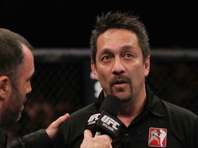 RIO DE JANEIRO, BRAZIL - JANUARY 14:  Referee Mario Yamasaki (R) explains his decision for calling the welterweight bout between Erick Silva and Carlo Prater during UFC 142 at HSBC Arena on January 14, 2012 in Rio de Janeiro, Brazil.  (Photo by Josh Hedges/Zuffa LLC/Zuffa LLC via Getty Images)