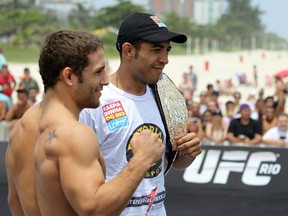 RIO DE JANEIRO, BRAZIL - JANUARY 11:  (R-L) UFC Featherweight Champion Jose Aldo and challenger Chad Mendes pose for photos during the UFC 142 Open Workouts at Barra de Tijuca Beach on January 11, 2012 in Rio de Janeiro, Brazil.  (Photo by Josh Hedges/Zuffa LLC/Zuffa LLC via Getty Images)