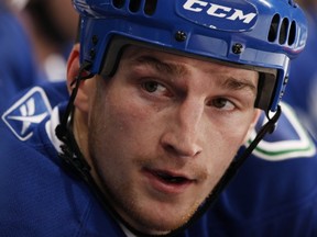 VANCOUVER — Rick Rypien looks on from the bench during an April 10, 2010 game at Rogers Arena against the Calgary Flames. The fallen former Canucks winger lost a battle with depression on Aug. 15, 2011. (Getty Images/via National Hockey League).