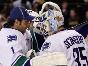 BOSTON — Cory Schneider gets a victory pat from Roberto Luongo after backstopping a 4-3 win against the Bruins on Jan. 7. The backup is hopeful the Vancouver Canucks will exercise the option to use two stoppers in the playoffs. (Getty Images/via National Hockey League).