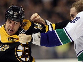 BOSTON — Dale Weise and Nathan Horton exchange first-period blows Saturday. The Vancouver Canucks winger was then challenged by Boston Bruins brute Shawn Thornton but declined. (Getty Images/National Hockey League).