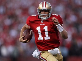 SAN FRANCISCO, CA - JANUARY 14:  Alex Smith #11 of the San Francisco 49ers runs in for a touchdown in the fourth quarter against the New Orleans Saints during the NFC Divisional playoff game at Candlestick Park on January 14, 2012 in San Francisco, California.  (Photo by Jed Jacobsohn/Getty Images)