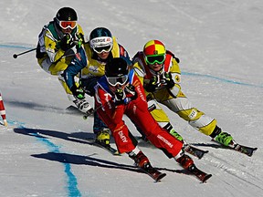 ALPE D'HUEZ, FRANCE - JANUARY 11:  (FRANCE OUT) Sanna Luedi of Switzerland (1st place),  Marielle Thompson of Canada (2nd place), Andrea Limbacher of Austria (3rd place) and Kelsey Serwa of Canada compete during the FIS Freestyle Ski World Cup Ski Cross on January 11, 2012 in Alpe d'Huez, France. (Photo by Michel Cottin/Agence Zoom/Getty Images)