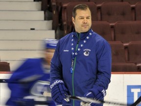 Canucks head coach Alain Vigneault running practice before the Western Conference quarterfinal series against the Chicago Blackhawks in April 2011.