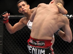 Anthony Pettis lands a fight-ending headkick against Joe Lauzon at UFC 144. The win will likely propel the former WEC lightweight champion into a title rematch with new UFC champ Benson Henderson. (photo courtesy of Zuffa LLC/Getty Images)