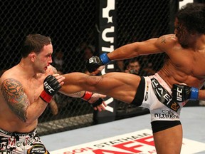 Benson Henderson lands a kick against Frankie Edgar in the main event of UFC 144 last night in Saitama, Japan. (photo courtesy of UFC Facebook Page)