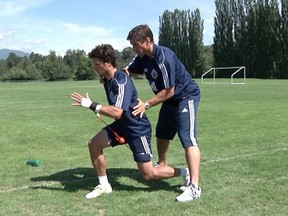 Rick Celebrini works with Whitecaps midfielder John Thorrington. Photo: whitecapsfc.com