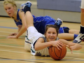 Riverside's Natalie Carkner scores her usual share of hustle points by diving for a loose ball. The Rapids enter the BC tourney next week as Fraser Valley champs. (PNG photo)