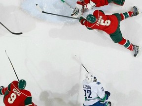 Daniel Sedin scores his 24th goal of the season against Minnesota on Feb. 9, 2012. For a change, Byron Bitz was not involved in the play. Getty Images photo.