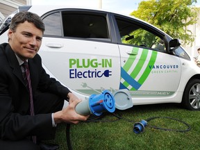 Vancouver Mayor Gregor Robertson shows off an electric car at the B.C. Institute of Technology in Burnaby  in May 2010. (Wayne Leidenfrost/ PNG FILES)
(For story by Frank Luba)