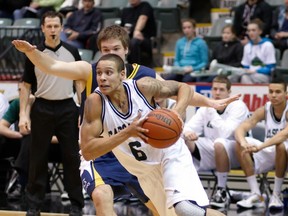 Fraser Valley Cascades’ scoring leader Joel Friesen drives for two of his game-high 24 points in an 88-72 win over Langley’s Trinity Western Spartans last Saturday in Abbotsford. Friesen, among the Canada West’s top scorers, went 13-for-13 from the free throw line in the victory. (Photo courtesy Tree Frog Imaging)