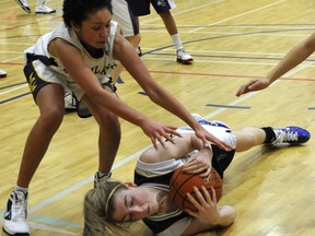 Lindsay O'Loughlin of Steveson-London grabs a loose ball in front of Kitsilano's Shonte Devernichuk during Lower Mainland senior girls Triple A tournament action Saturday in Richmond. (Jenelle Schneider, PNG)