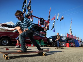 Dillan Shofner, 10, rides his longboard in the infield during the Daytona 500 at Daytona International Speedway in Daytona Beach, Fla., on Feb. 20, 2011. (MCT-FILES)