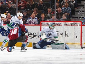 Jay McClement's goal on Roberto Luongo early in the second period looked like the winner for the Colorado Avalanche, until Kevin Bieksa scored with less than a minute left to send the game to OT and a shootout. (Michael Martin/Getty Images)