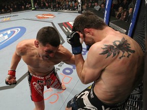 LAS VEGAS - FEBRUARY 04: Nick Diaz (left) punches Carlos Condit during the UFC 143 event at Mandalay Bay Events Center on February 4, 2012 in Las Vegas, Nevada. (Photo by Nick Laham/Zuffa LLC/Zuffa LLC via Getty Images)