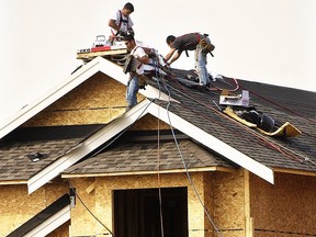 One reader who is a safety officer objected to The Province running this photograph of roofers working without safety harnesses, saying it sets a bad example. (Ric Ernst/PNG FILES)