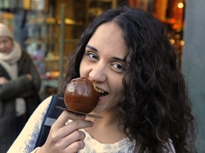 Luisa Vieira, 16, still likes her candied apples, despite a report that says sugar is so toxic to our health it should be controlled like alcohol. (Les Bazso/PNG FILES)