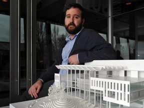 UBC Alma Mater Society president Jeremy McElroy with a scale model of the planned new Student Union Building, which will house a microbrewery. Photo: Arlen Redekop, PNG