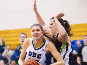 UBC's Zara Huntley (left) takes an inside path to the hoop against UFV's Sam Kurath during CIS women's basketball action Saturday at Abbotsford. (Photo by Ron Hole)