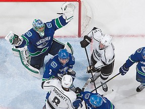 Roberto Luongo and the Vancouver Canucks celebrate victory against Los Angeles.