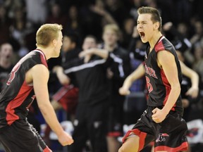 Terry Fox Ravens' Daniel Collins (left) and Jesse Crookes celebrate Crookes' game-winning shot Saturday against Walnut Grove. (Gerry Kahrmann, PNG)