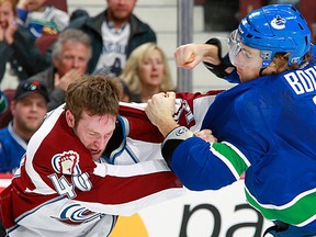 David Booth fights for the Vancouver Canucks