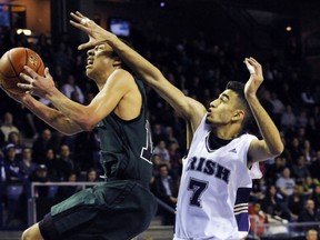 Walnut Grove's David Wolde-Mariam gets past Vancouver College's Abu Khan on Friday in the opening game of the Final Four at the LEC. (Stuart Davis, PNG)