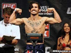 "Uncle Creepy" Ian McCall on the scale at weigh-ins yesterday for his UFC on FX 2 fight with Demetrious Johnson. (photo courtesy of MMA Junkie)