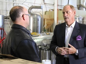 Dead Frog owner Derrick Smith (left) with Jim Treliving at the Dead Frog Brewery in Aldergrove during the filming of CBC's The Big Decision.(CBC photo)