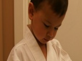 My boy taking a quiet moment during Martial Arts.