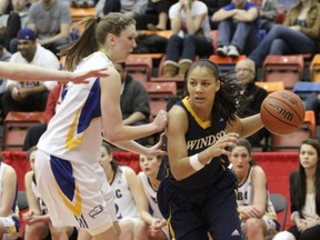 Korissa Williams (right) is guarded by UBC's Kris Young on Monday in the CIS final at Calgary. (Calgary Herald photo)