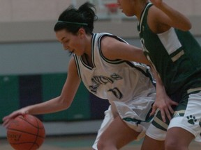 Riverside's Laiken Cerenzie (left) is guarded by York House's Alisha Roberts. (Paul van Peenen, Coquitlam Now)