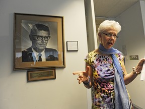 B.C. Teachers' Federation president Susan Lambert speaks to media beside a portrait of John Prior, head of the BCTF from 1953 to 1954. (Arlen Redekop/PNG FILES)
