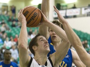 Michael Lieffers battles a pair of Victoria Vikes as the Huskies won the third-place game at the Canada West Final Four on Saturday in Saskatoon. (Saskatoon Star Phoenix)
