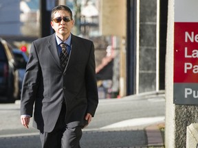 Cpl. Monty Robinson arrives Feb. 22 at the New Westminster courthouse to hear the closing arguments in his trial for obstruction of justice in connection with the crash that killed Orion Hutchinson in Delta. (Ward Perrin/PNG FILES)