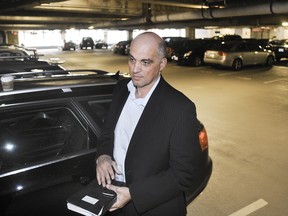 TransLink's tax grab on parking tripled in 2010. Vito Desicoo in a downtown parking lot was one driver very unhappy about the additional taxes. (Bill Keay/PNG FILES)