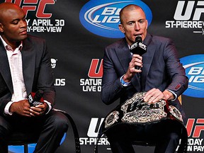 Anderson Silva and Georges St-Pierre share the stage at UFC 129's "Super Seven" event last April in Toronto.